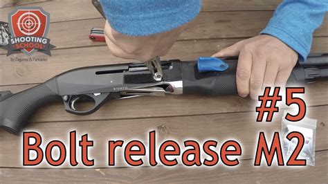 benelli m2 bolt release button